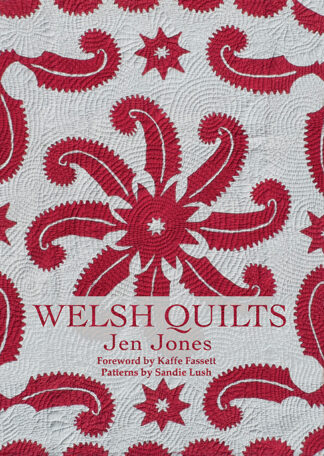 This cover shows a light grey background with a red pattern quilted on. The Text reads: Welsh Quilts. Jen Jones. Foreword by Kaffe Fassett. Patterns by Sandie Lush.