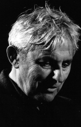 Black and white photo of Dannie Abse. He is in profile and is looking down and away from the camera.