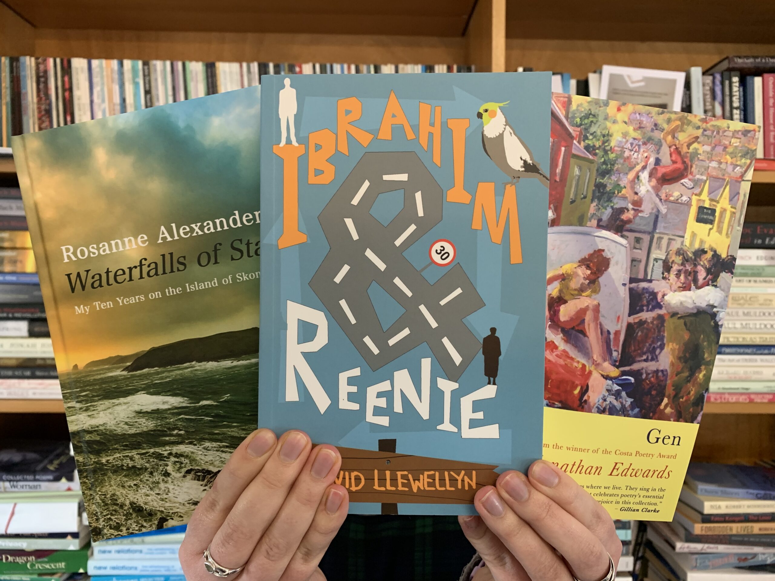 Copies of Waterfalls of Stars, Ibrahim and Reenie and Gen being held in the air.