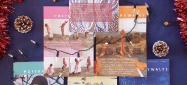 Issues of poetry wales laid out against a blue background in the shape of a Christmas tree