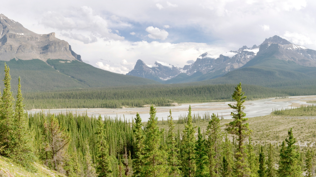 A mountain landscape beneath a cloudy sky