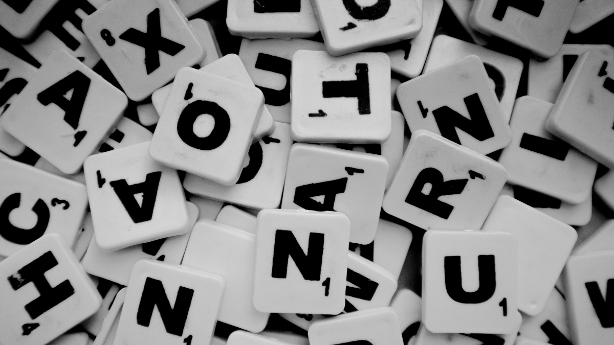 Black and white photo of a pile of scrabble tiles