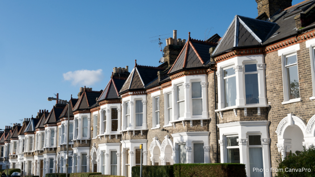 Photo of terraced houses beneath a blue sky