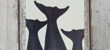 Copy of Whaling laid out against a wood effect background