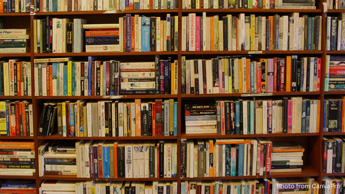 Photo of shelves crammed tight with books.