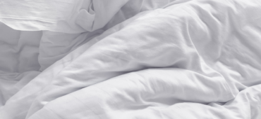 Photo of a crumpled white duvet