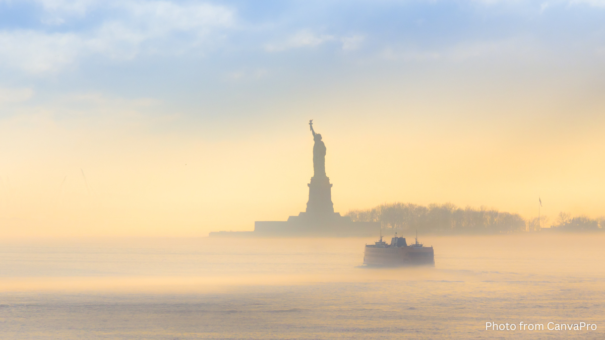 Photo of the statue of liberty surrounded by morning mist.