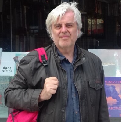 Photo of Nick Freeman standing outside a shop window
