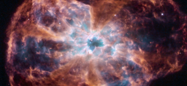 Image of a dying star in the middle of a swirling cloud of dust and light