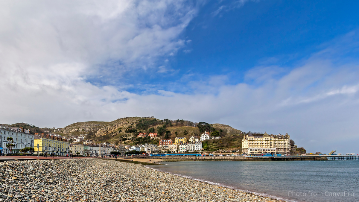 Photo of Llandudno seafront taken from the pebbled beach.