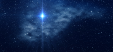 Photo of a bright star shining against a midnight blue sky