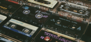Close up photo of cassette tapes laid out on a table.