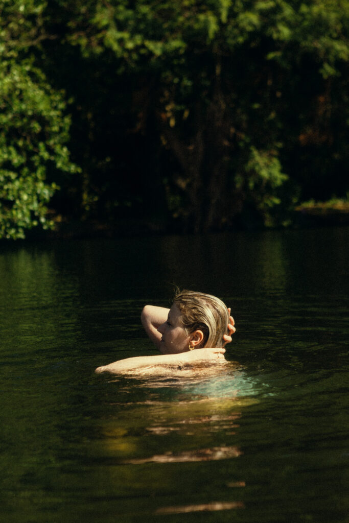 Photo of Megan Hayes swimming in a lake.