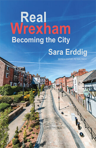 This cover shows a zoomed out photo of a street of terraced houses in Wrexham. The text reads: Real Wrexham Becoming the City, Sara Erddig.