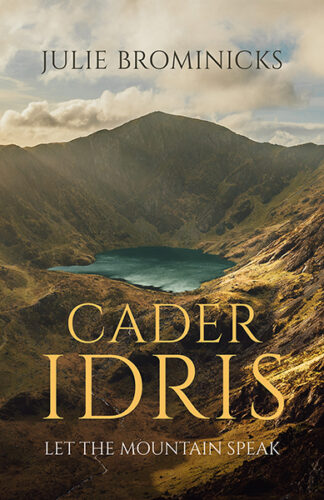 This photo shows a dramatic photo of Cader Idris bathed in the golden glow of the setting sun. The text reads: Cader Idris: Let the Mountain Speak, Julie Brominicks