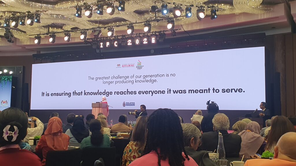 Photo of Adibah Omar giving her presentation at the congress