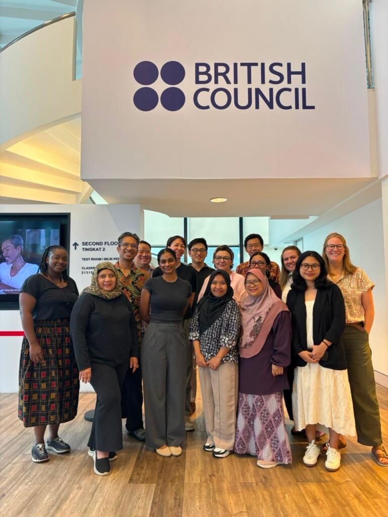 Group of people standing in the lobby of the British Council offices in Malaysia