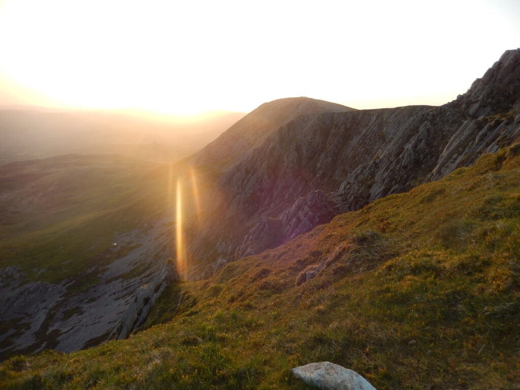 Photo of the sun rising over the slopes of Cader Idris